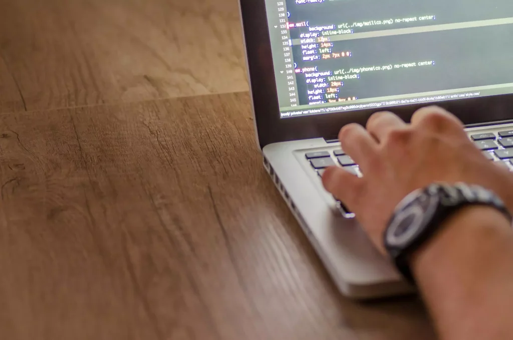 Laptop, hand typing, code